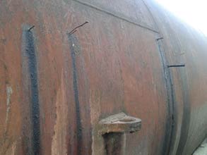 Wooden pegs plug leaking tank