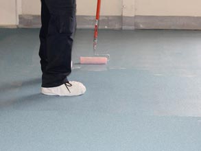 Floor protection at a warehouse: Belzona 5231 Grey (base coat), Belzona 9232 (aggregate) and Belzona 5233 Clear (top coat)